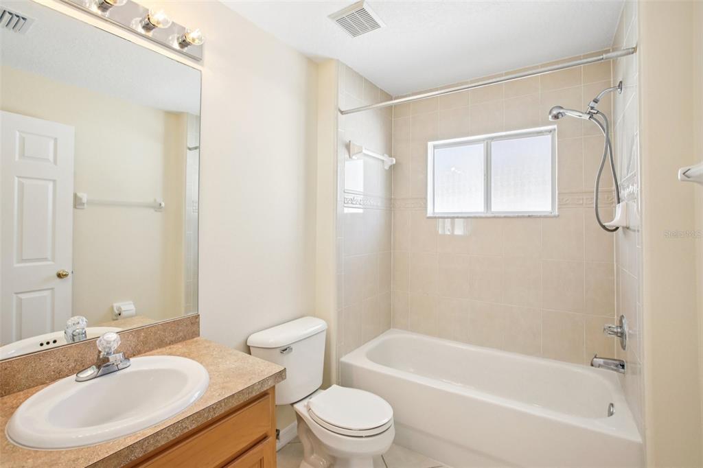 2719 West Union Street Tampa, FL 33607 - Photo 18 of 27 a bathroom with a sink toilet and shower