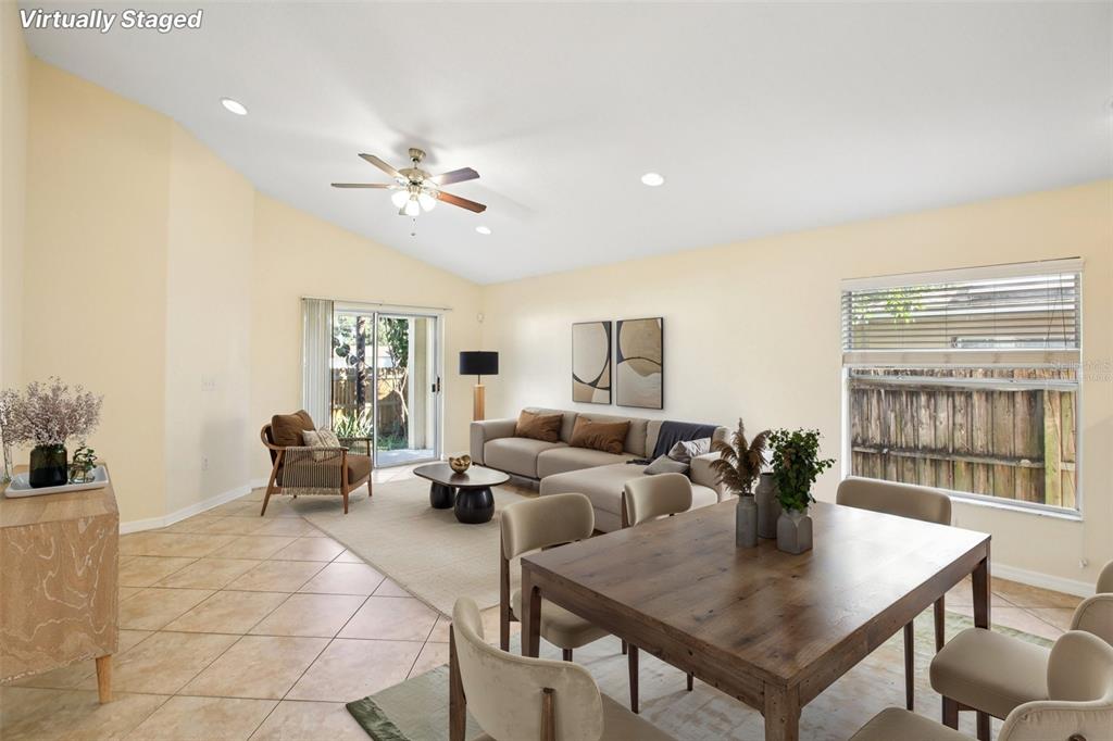 2719 West Union Street Tampa, FL 33607 - Photo 2 of 27 a living room with furniture a chandelier and a window
