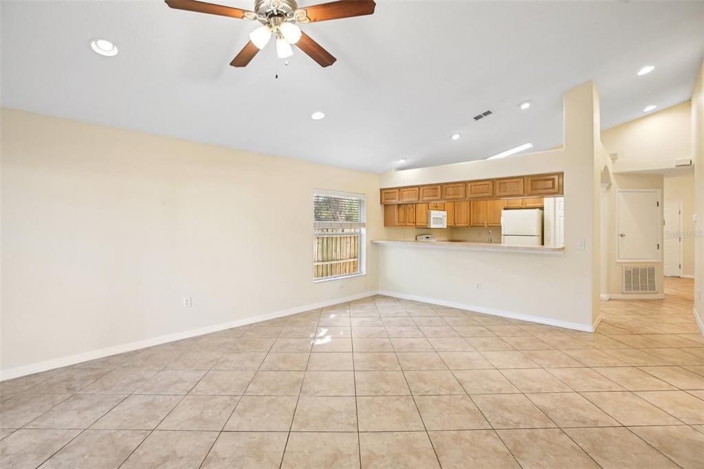 2719 West Union Street Tampa, FL 33607 - Photo 5 of 27 a view of a big room with wooden floor and a ceiling fan