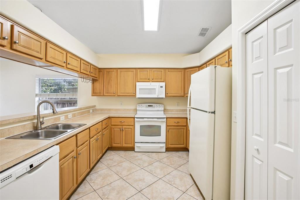 2719 West Union Street Tampa, FL 33607 - Photo 8 of 27 a kitchen with stainless steel appliances granite countertop a refrigerator and a sink