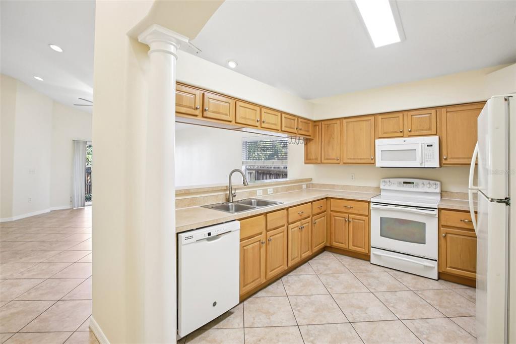 2719 West Union Street Tampa, FL 33607 - Photo 9 of 27 a kitchen with white cabinets and white appliances