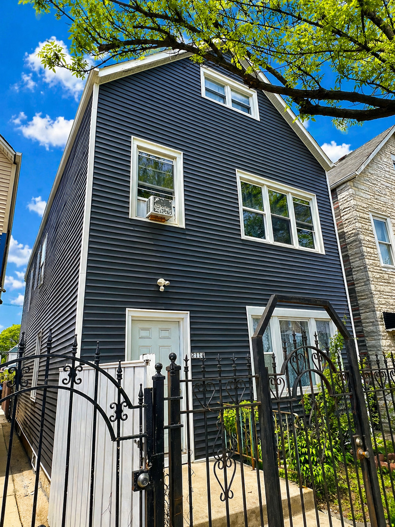 2114 West 51st Street, Unit 1 Chicago, IL 60609 - Photo 2 of 9 a front view of a house with glass windows