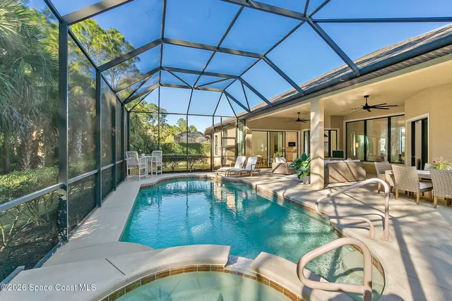 a view of a swimming pool with a patio