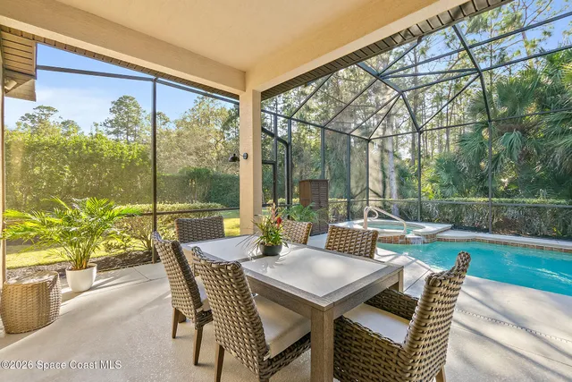 a view of an outdoor space with furniture and garden