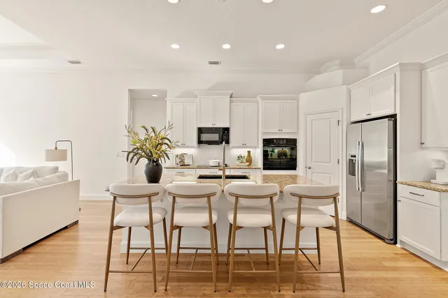 a kitchen with a sink stove and refrigerator