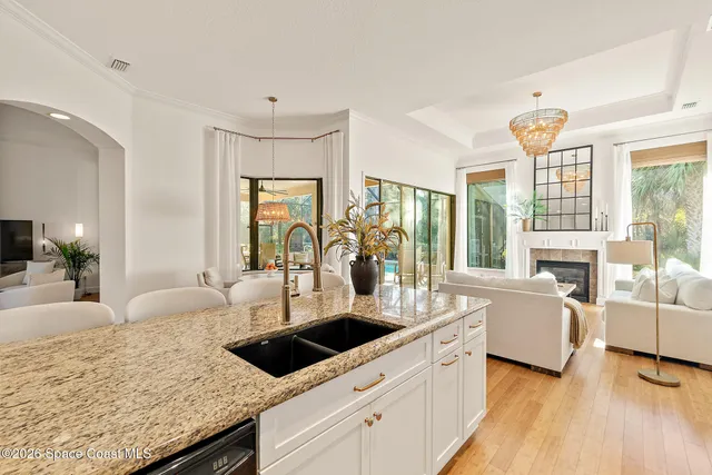 a spacious bedroom with a large bed and a large window