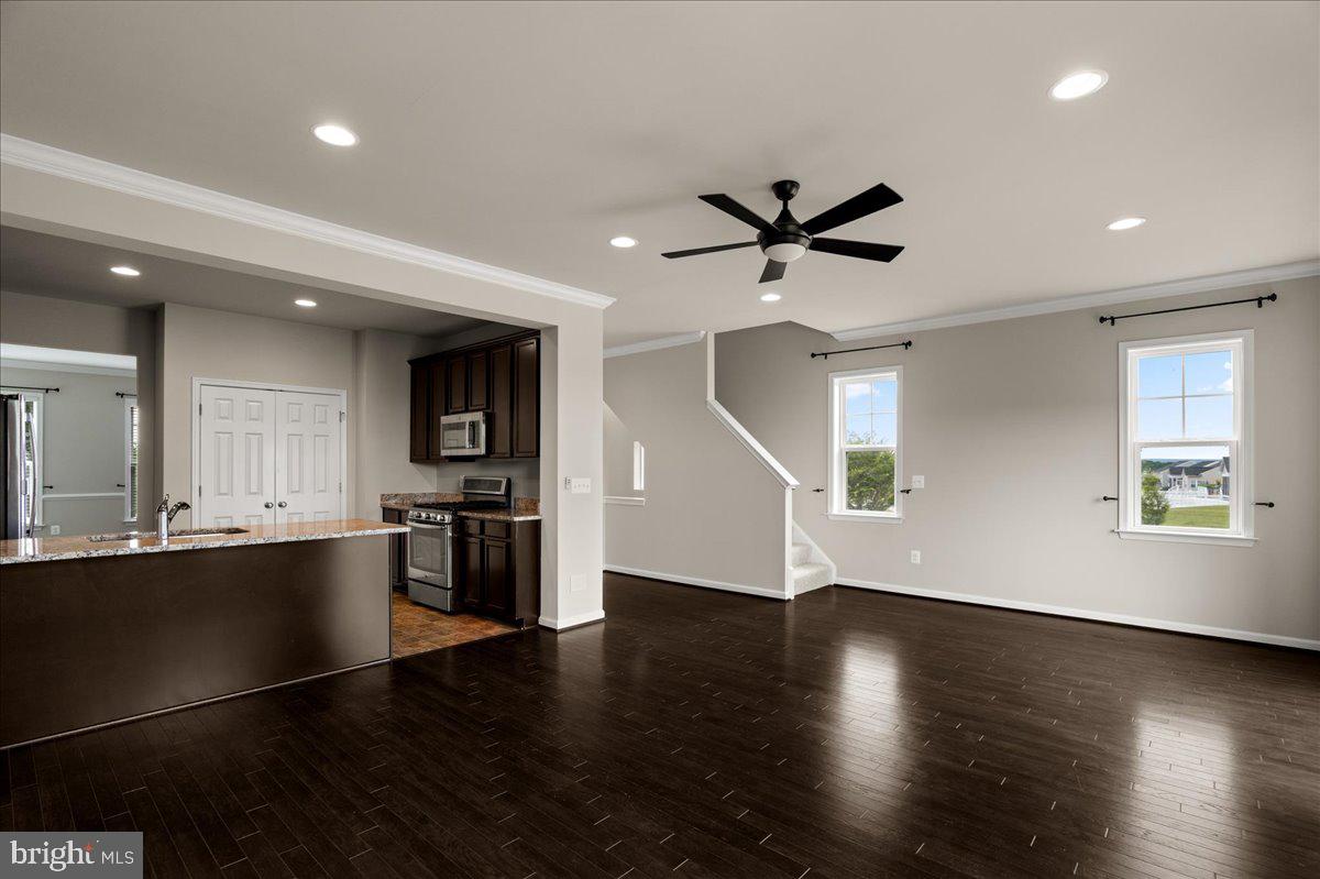 101 Jitterbug Way Stephenson, VA 22656 - Photo 17 of 39 an open kitchen with wooden floor and stainless steel appliances