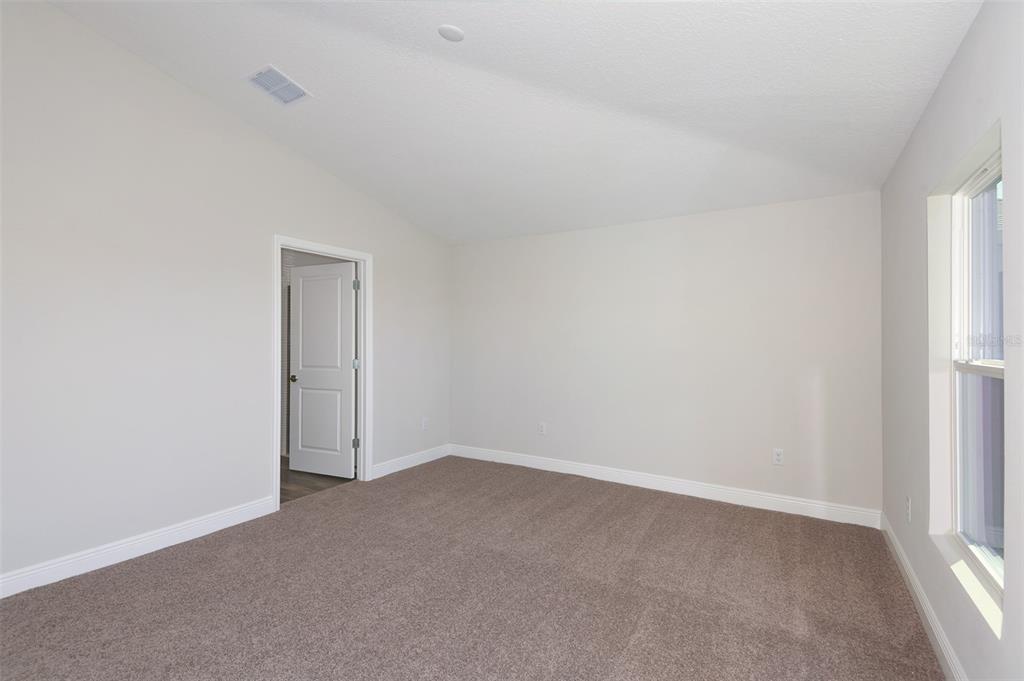 6103 Southwest 97th Street Ocala, FL 34476 - Photo 5 of 26 a view of an empty room and a window