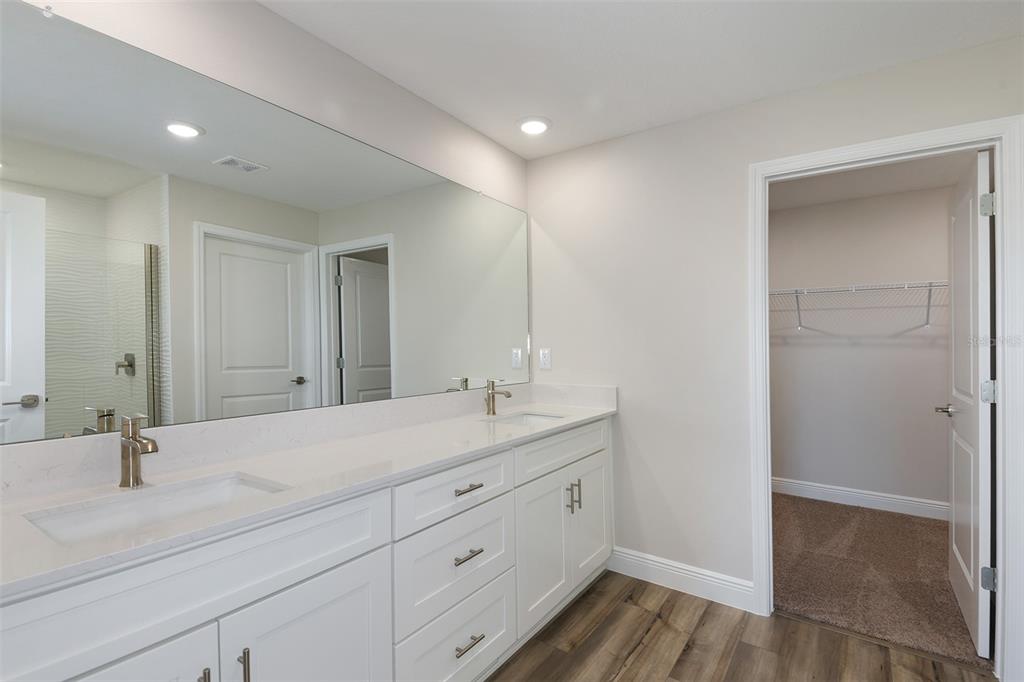 6103 Southwest 97th Street Ocala, FL 34476 - Photo 7 of 26 a bathroom with a sink and a mirror