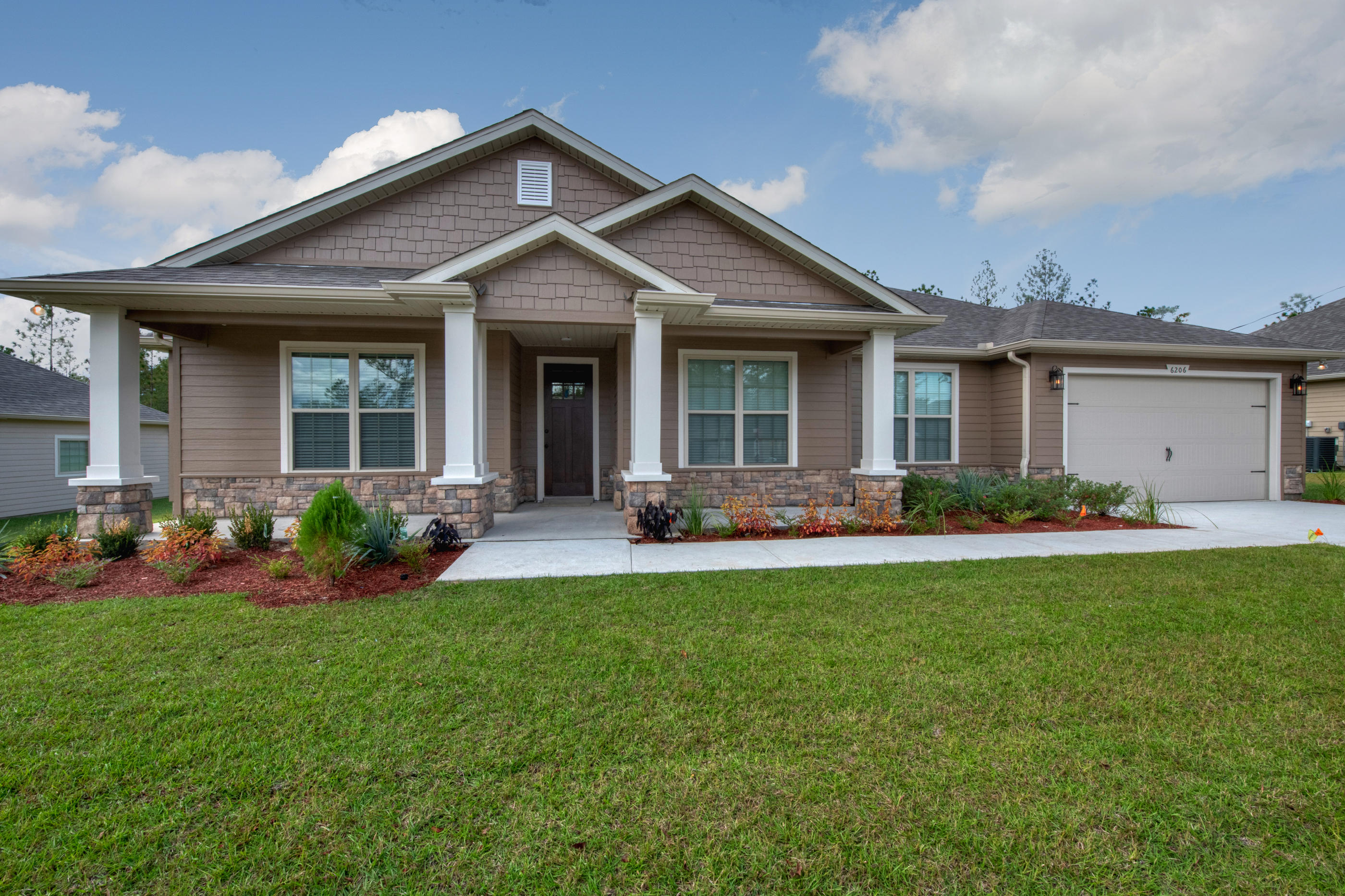 6198 Timberland Ridge Drive Crestview, FL 32539 - Photo 1 of 37 front view of a house with a yard