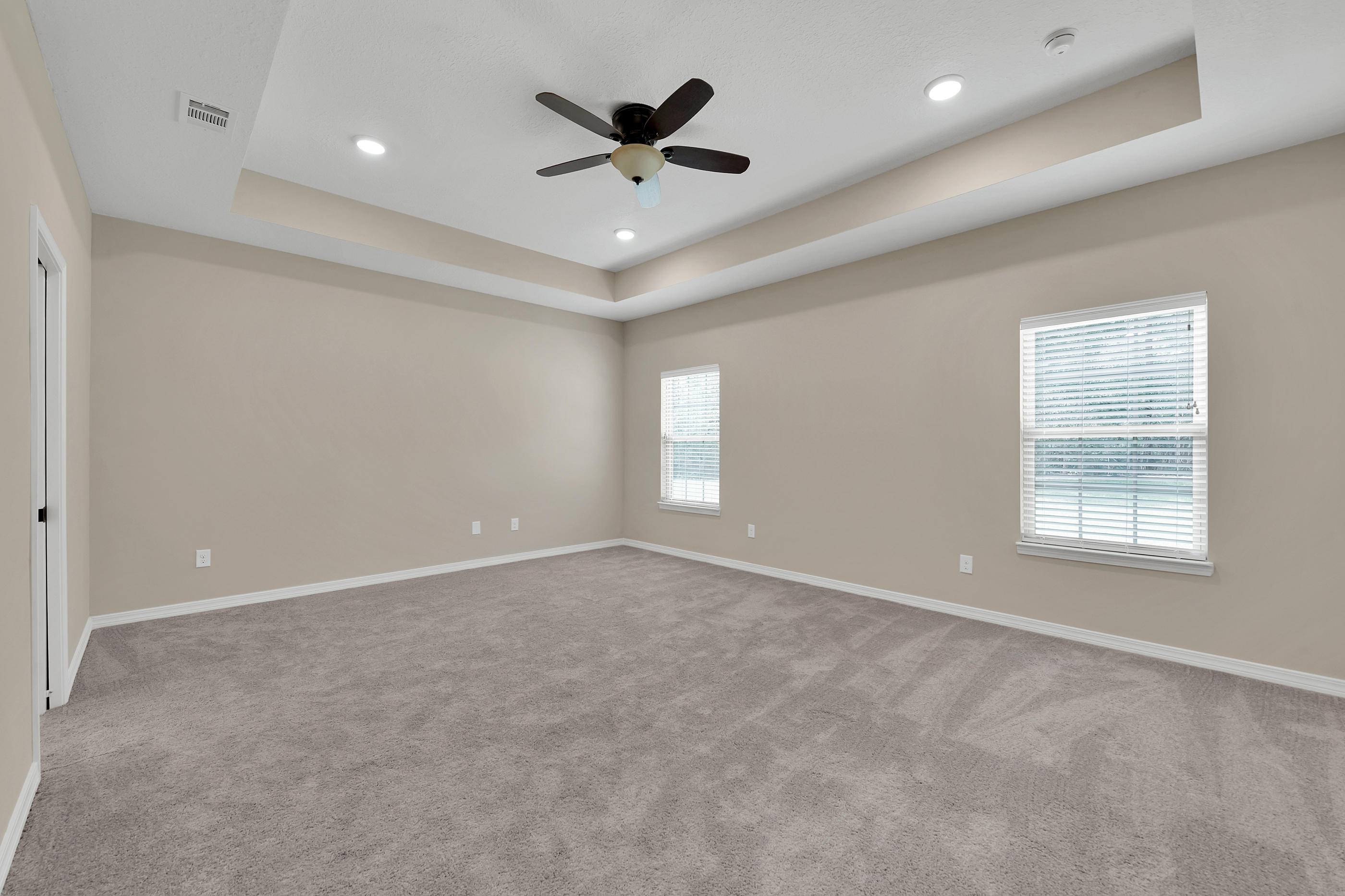 6198 Timberland Ridge Drive Crestview, FL 32539 - Photo 24 of 37 an empty room with ceiling fan and windows