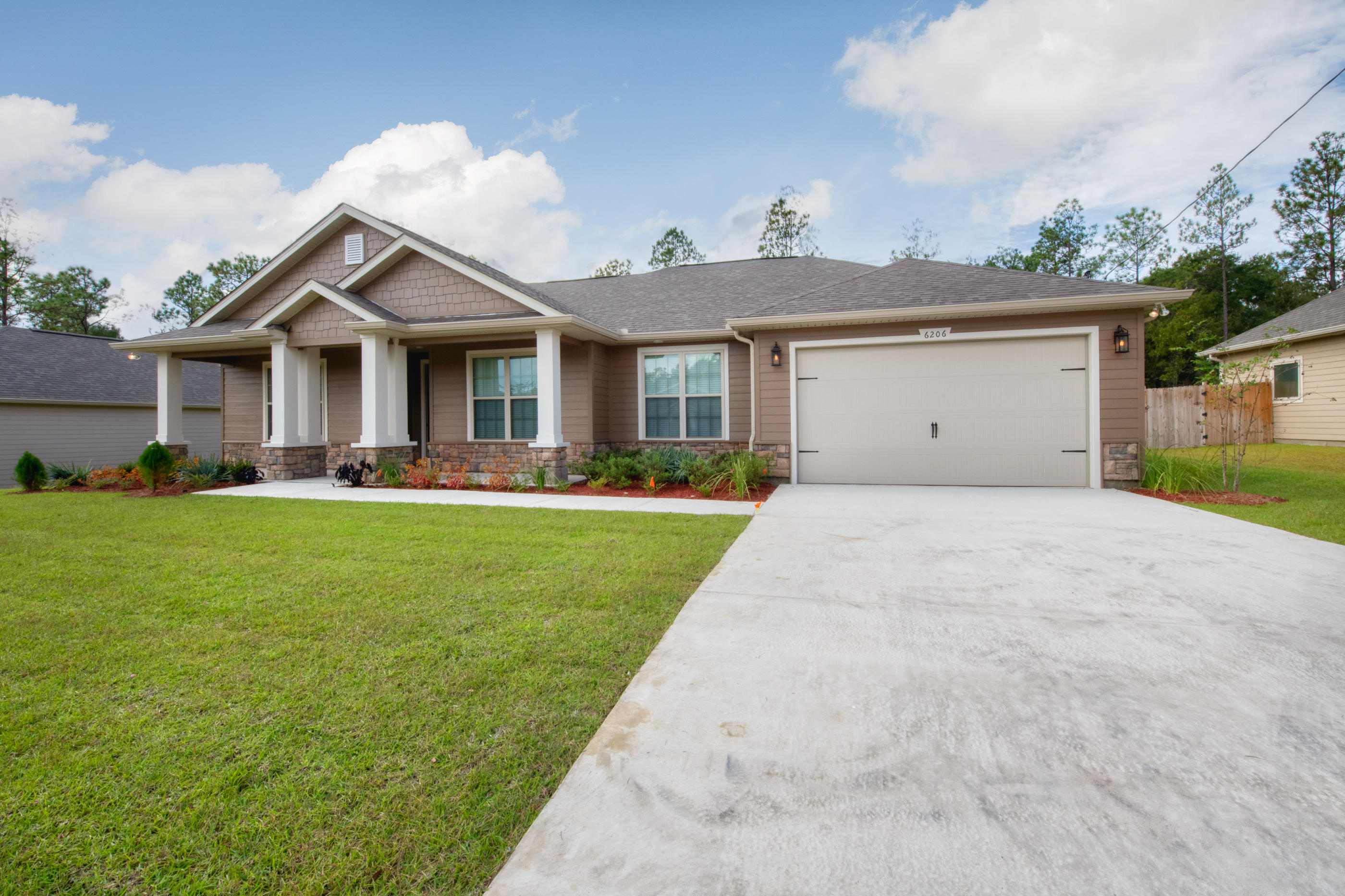 6198 Timberland Ridge Drive Crestview, FL 32539 - Photo 3 of 37 a front view of house with yard and green space
