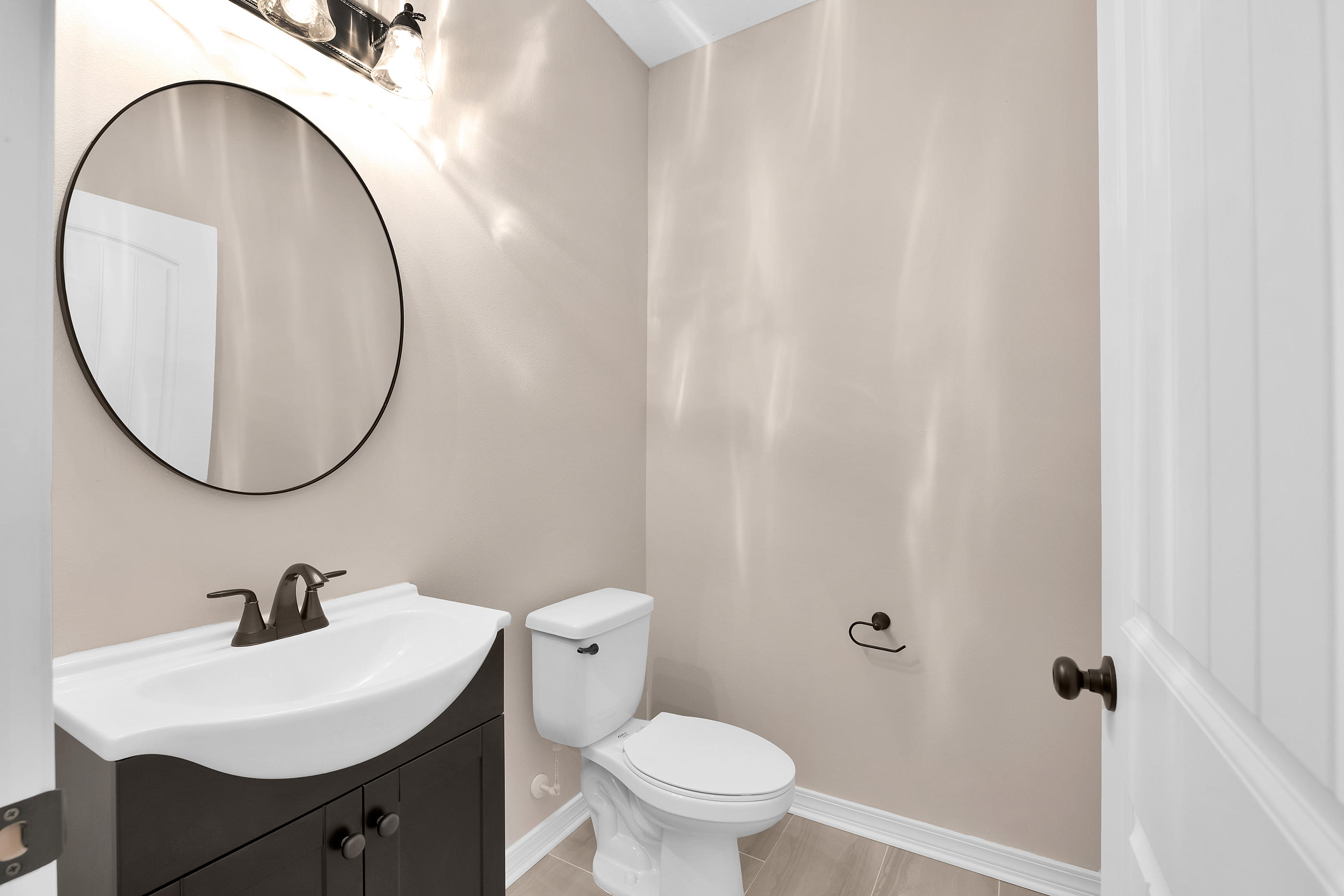 6198 Timberland Ridge Drive Crestview, FL 32539 - Photo 9 of 37 a bathroom with a sink and a mirror