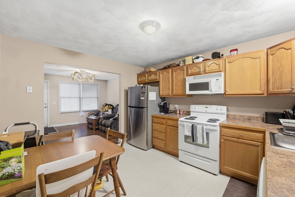 248-252 Church Street Burrillville, RI 02859 - Photo 11 of 26 a kitchen with a sink appliances and cabinets