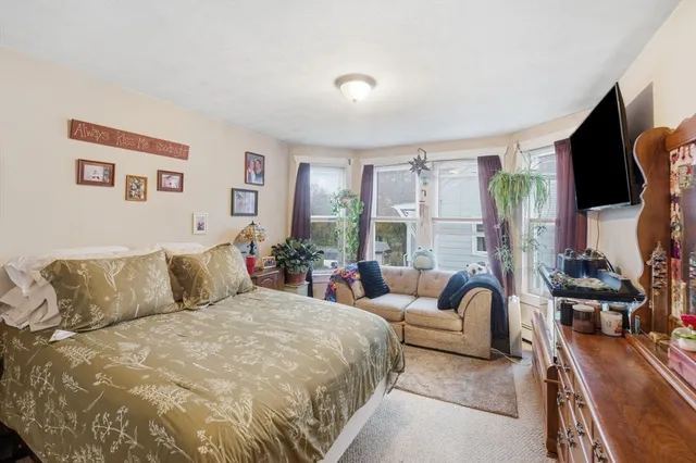 a bed room with a bed and a window