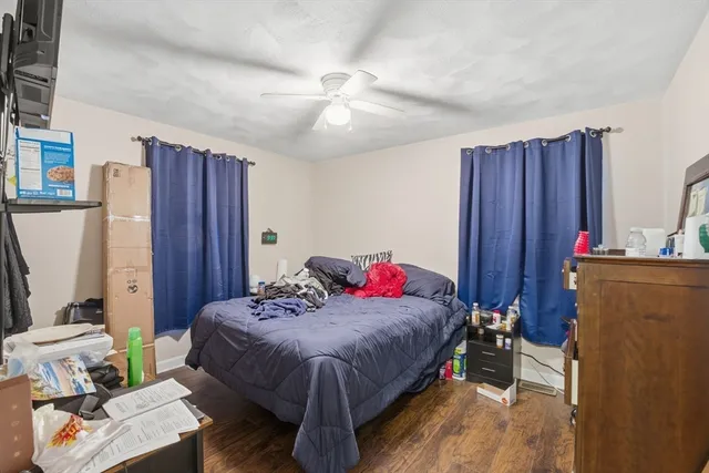 a bedroom that has a bed and a closet