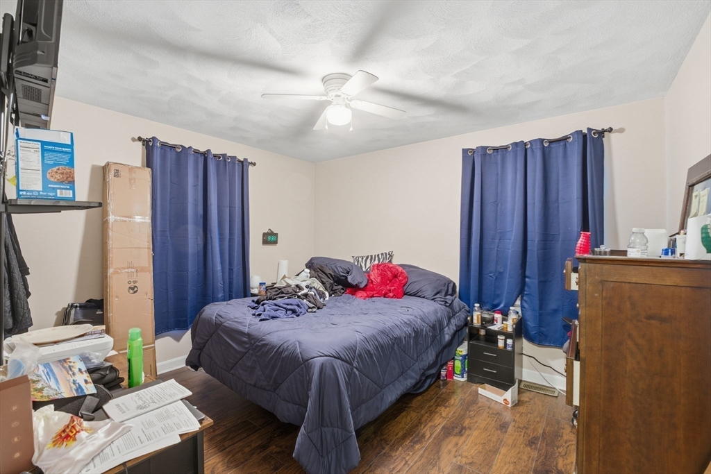 248-252 Church Street Burrillville, RI 02859 - Photo 18 of 26 a bed room with a bed and a window