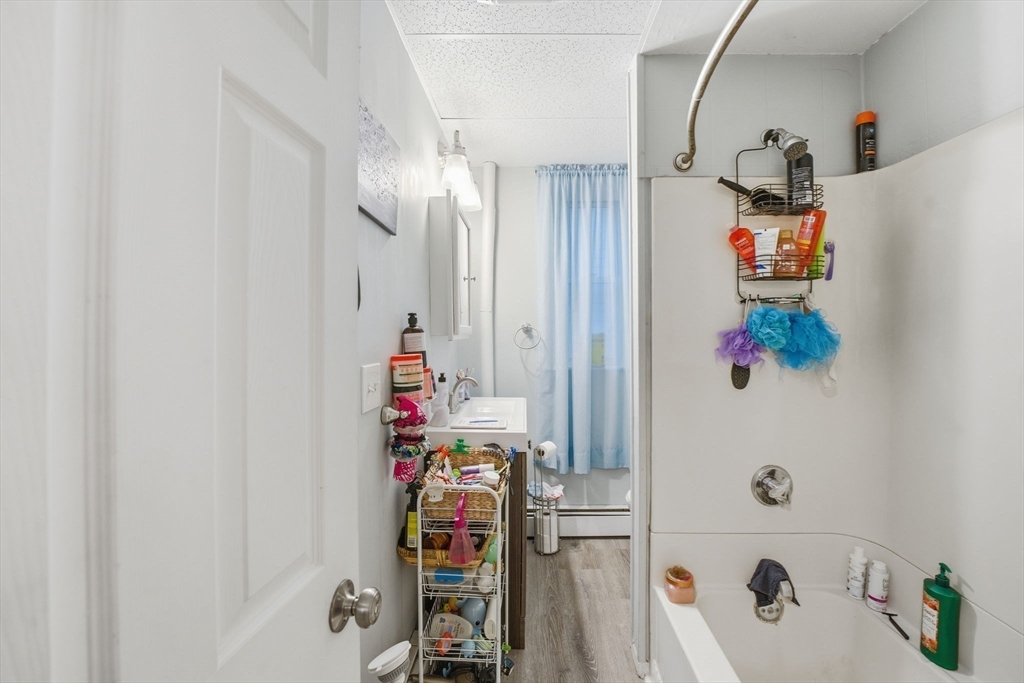 248-252 Church Street Burrillville, RI 02859 - Photo 21 of 26 a bathroom with a bathtub and shower