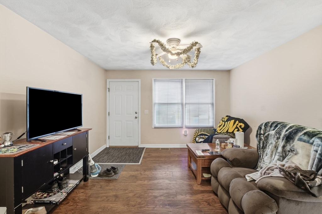 248-252 Church Street Burrillville, RI 02859 - Photo 7 of 26 a living room with furniture and a flat screen tv