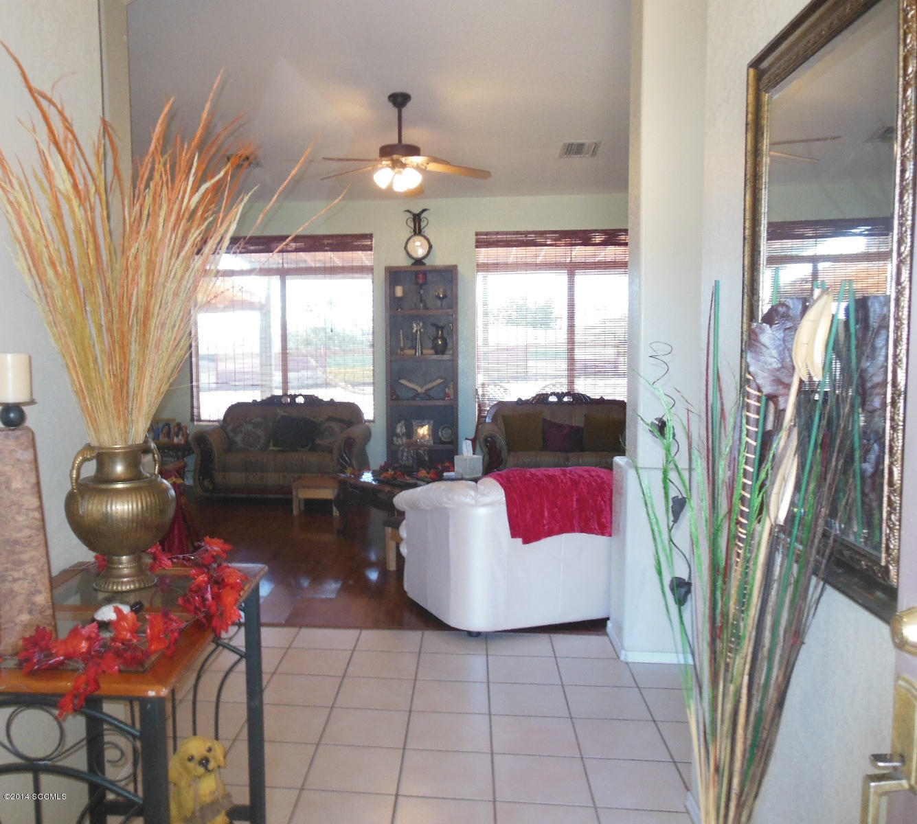 1116 Paseo Espuelas Rio Rico, AZ 85648 - Photo 26 of 26 a living room with furniture and a floor to ceiling window