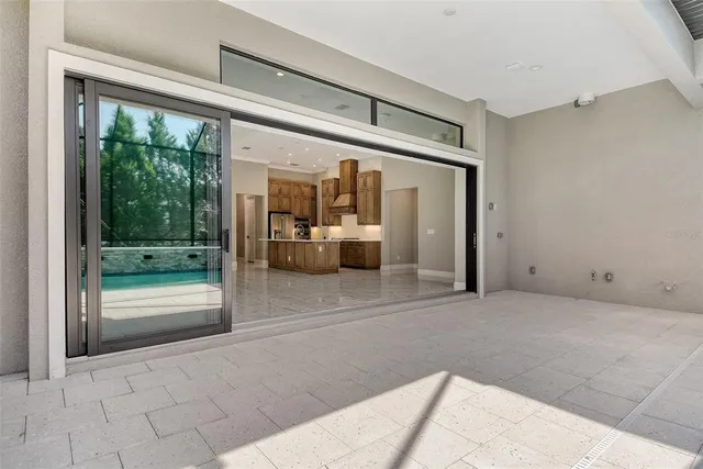 a view of a livingroom with kitchen and furniture