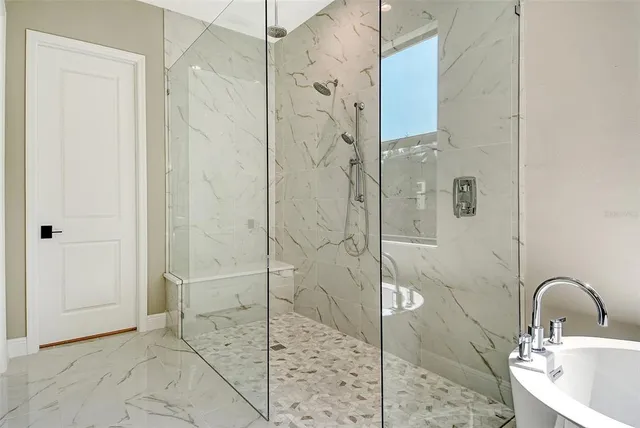 a bathroom with a toilet and shower