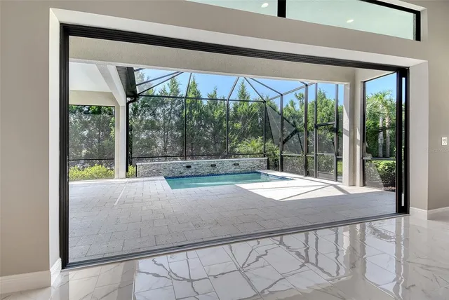 a kitchen with stainless steel appliances granite countertop a sink a stove and a refrigerator