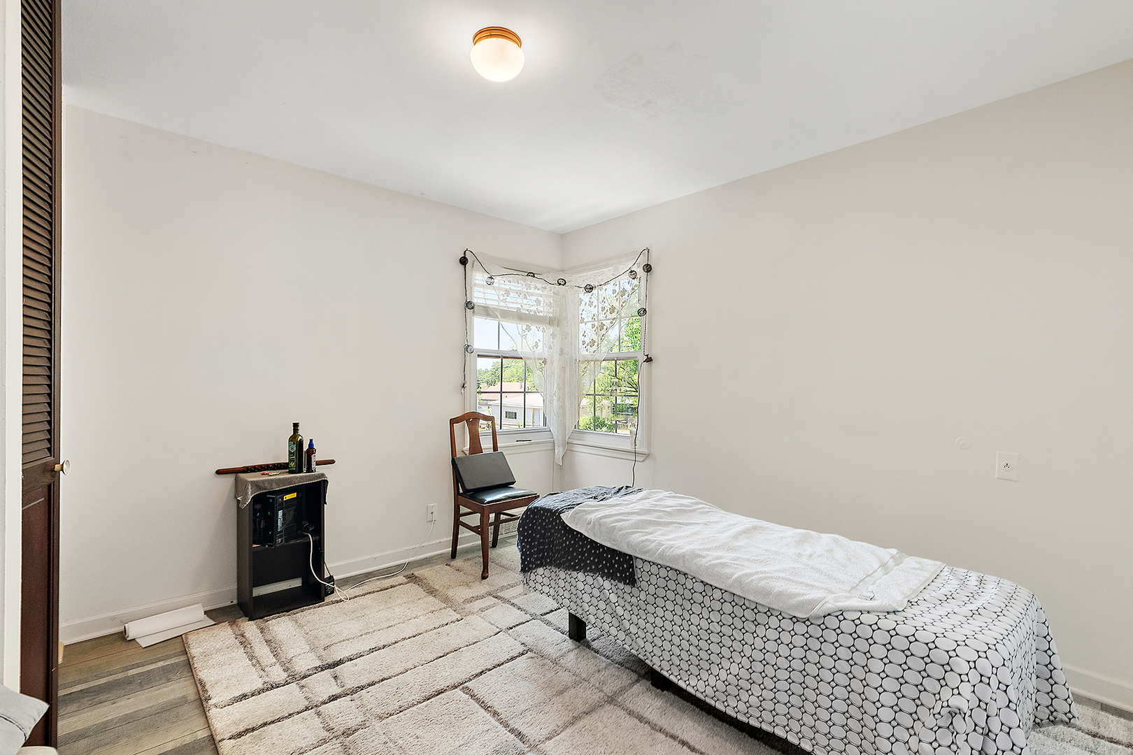 8420 Archer Avenue Willow Springs, IL 60480 - Photo 17 of 33 a bedroom with a bed and wooden floor