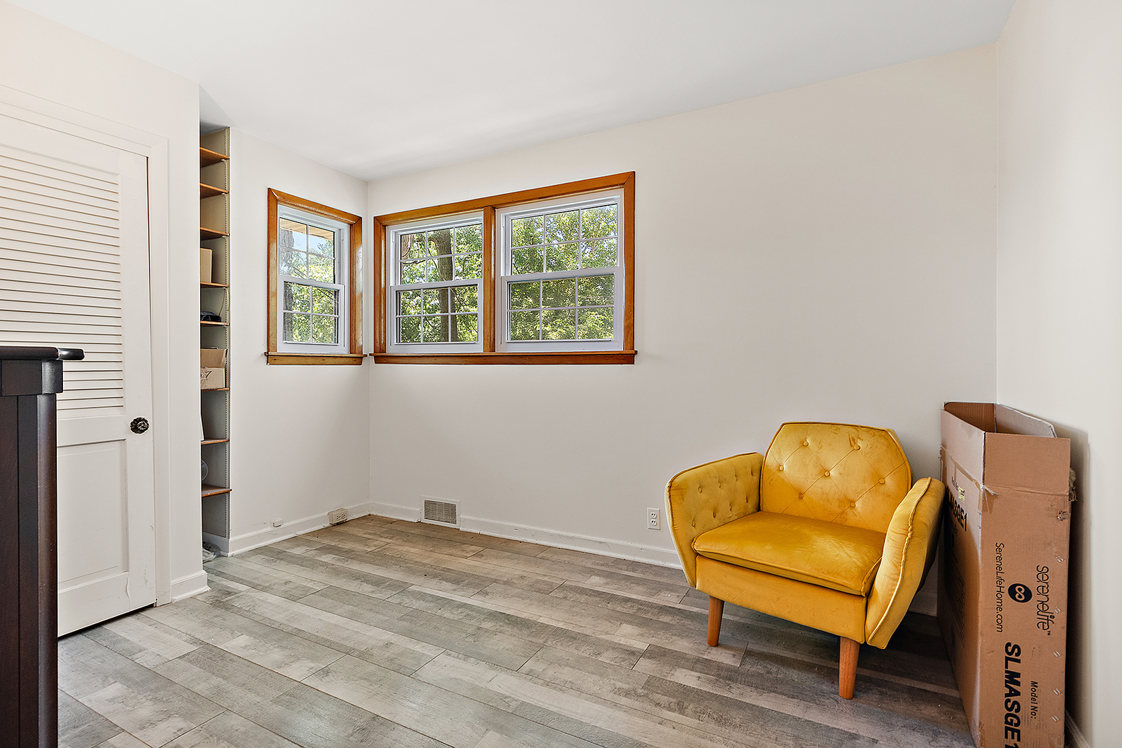 8420 Archer Avenue Willow Springs, IL 60480 - Photo 18 of 33 a room with a window and a chair