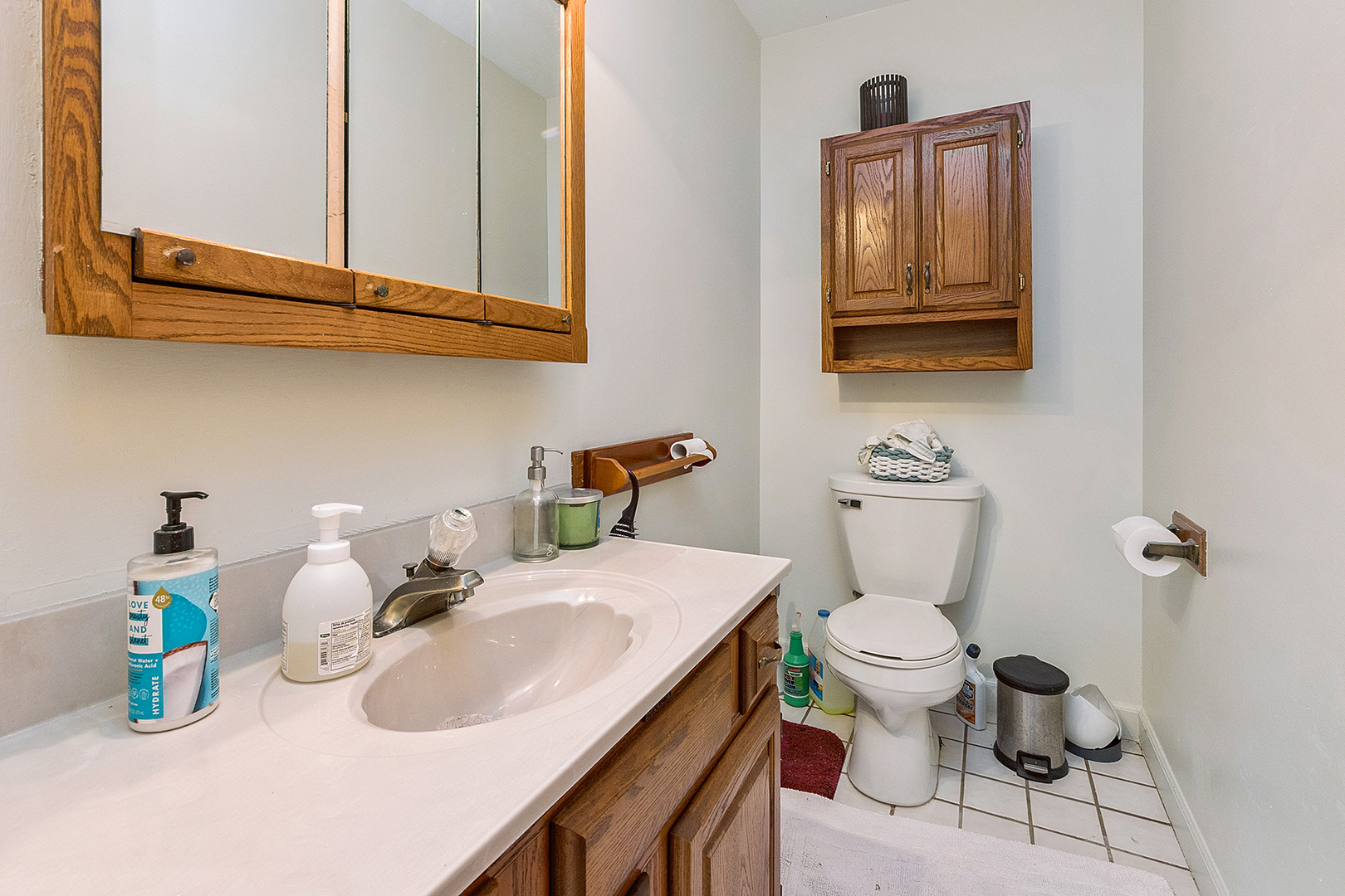 8420 Archer Avenue Willow Springs, IL 60480 - Photo 19 of 33 a bathroom with a sink a toilet and a mirror