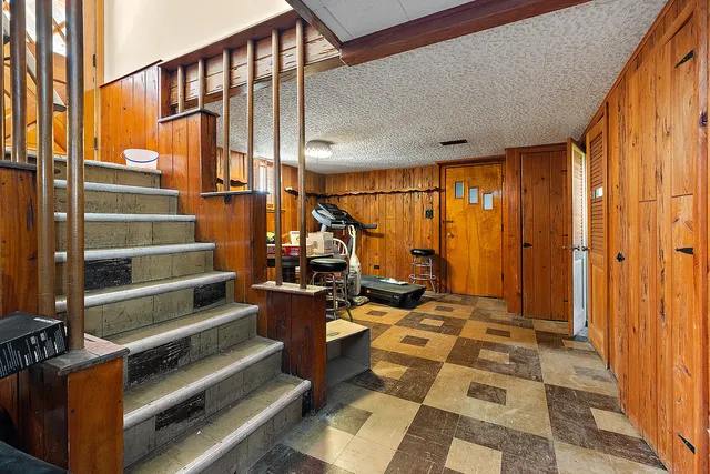 a view of a room with wooden walls