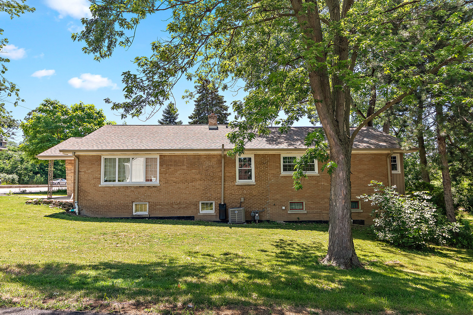 8420 Archer Avenue Willow Springs, IL 60480 - Photo 24 of 33 a front view of a house with a garden