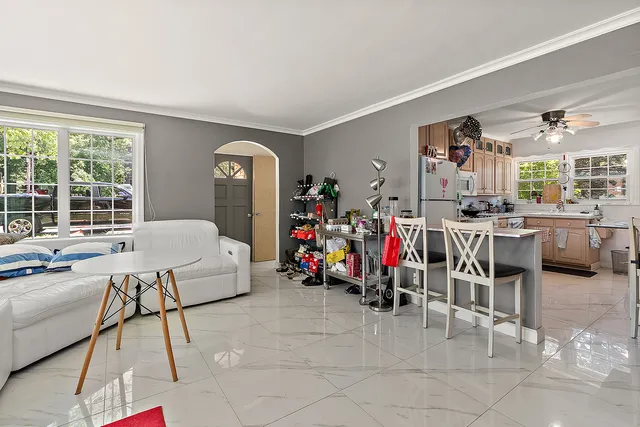 a bed room with furniture and a window