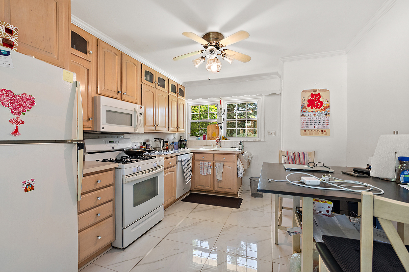 8420 Archer Avenue Willow Springs, IL 60480 - Photo 9 of 33 a kitchen with a stove cabinets and window