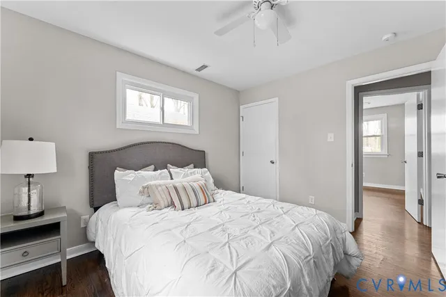 a bedroom with a bed and a night stand