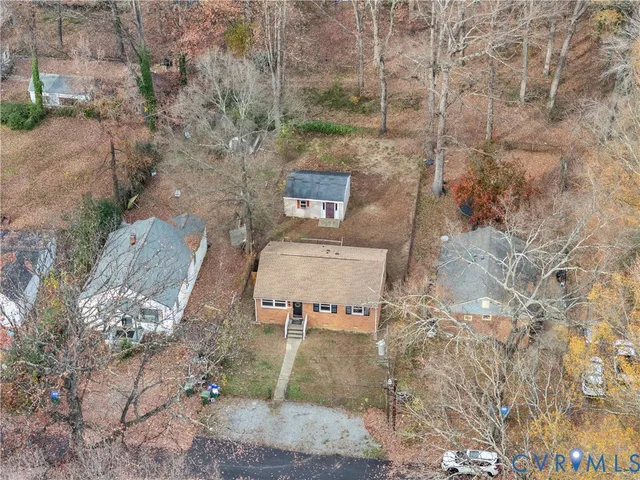 a view of a patio with chairs and a table