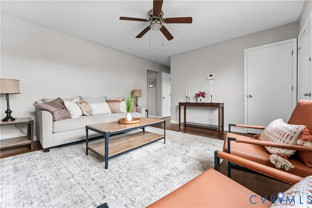 a living room with furniture and a rug