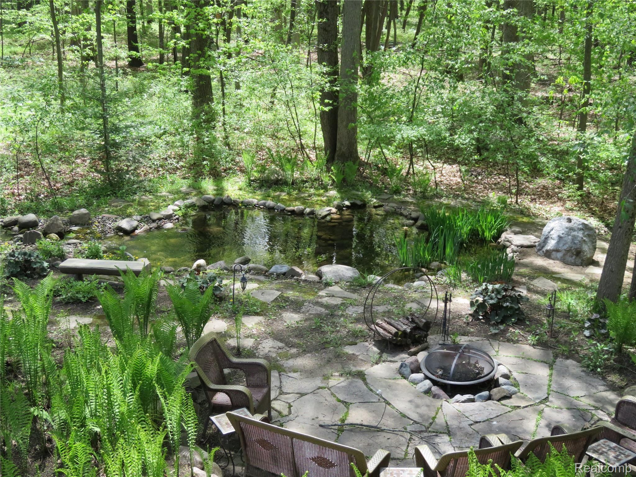 701 Argentine Road Howell, MI 48843 - Photo 45 of 45 Pond, Fire Pit and Patio Area View from Deck