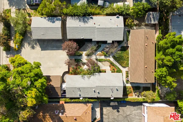 an aerial view of a house with yard swimming pool and outdoor seating