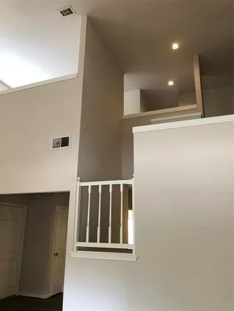 a view of empty room with window and fireplace