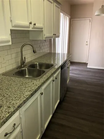 a kitchen with a stove and a microwave