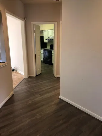 a view of empty room with floor to ceiling window