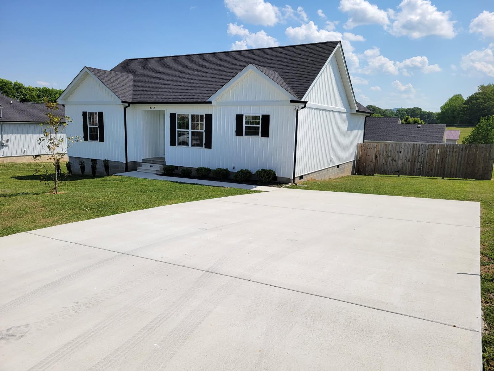62 Modena Place Decherd, TN 37324 - Photo 1 of 31 a front view of a house with a yard and garage