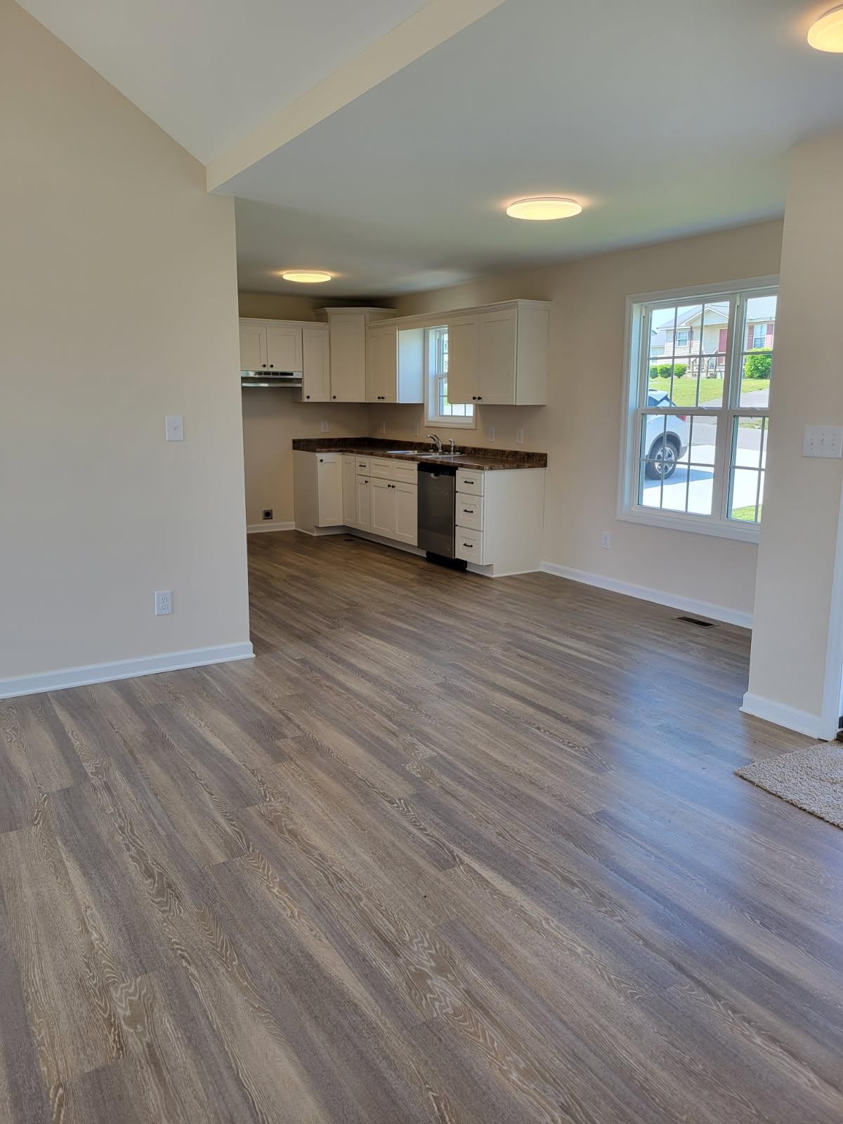 62 Modena Place Decherd, TN 37324 - Photo 11 of 31 an empty room with wooden floor and windows