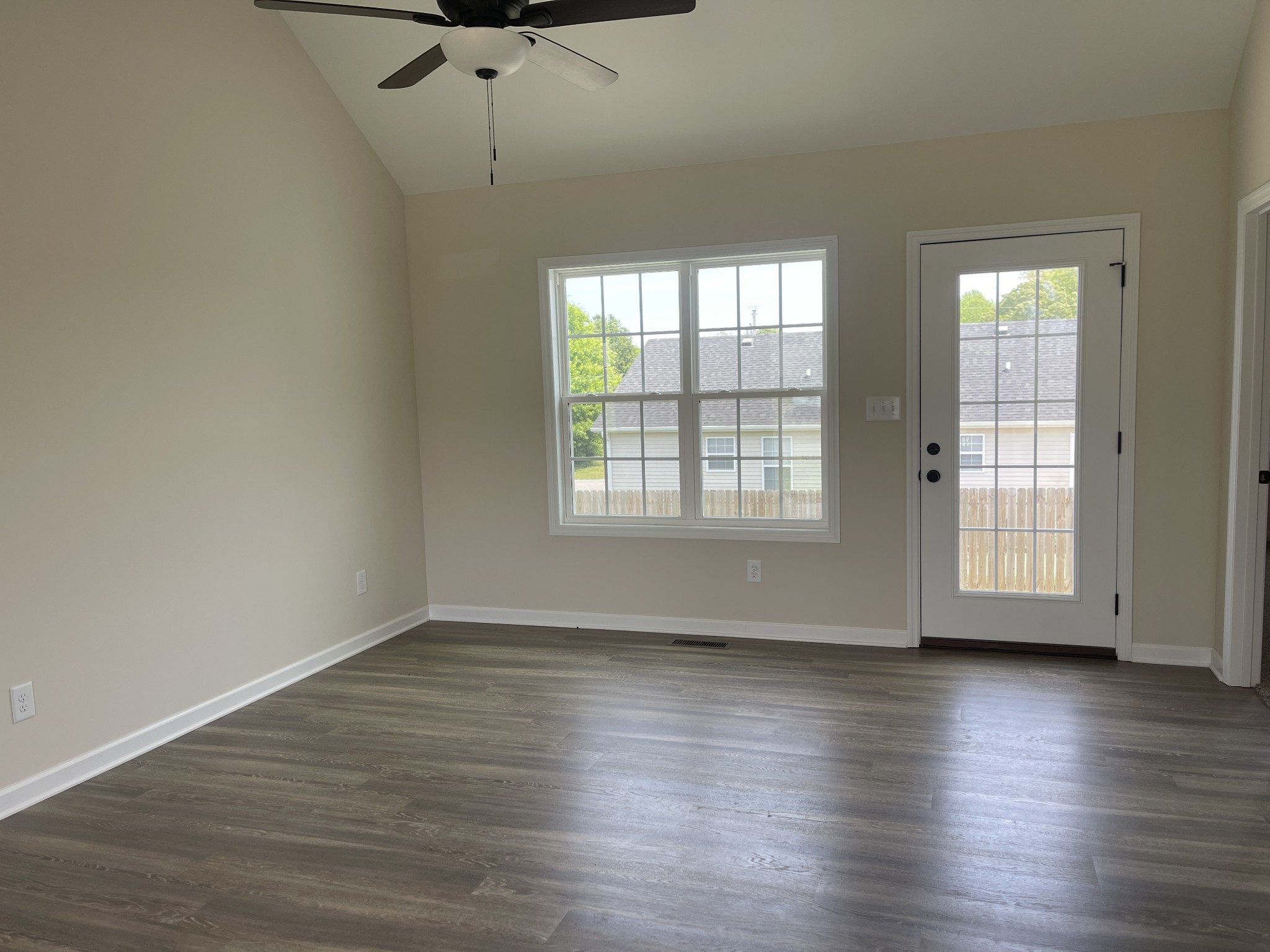 62 Modena Place Decherd, TN 37324 - Photo 13 of 31 a view of an empty room with wooden floor and a window