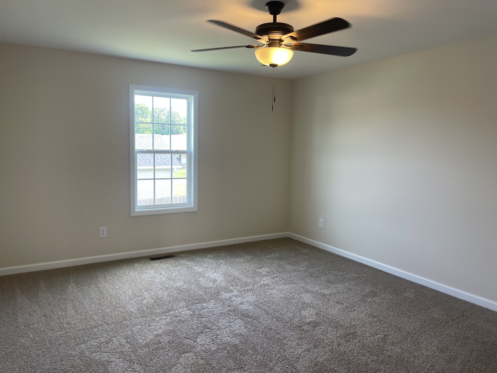 62 Modena Place Decherd, TN 37324 - Photo 16 of 31 an empty room with a window and a fan