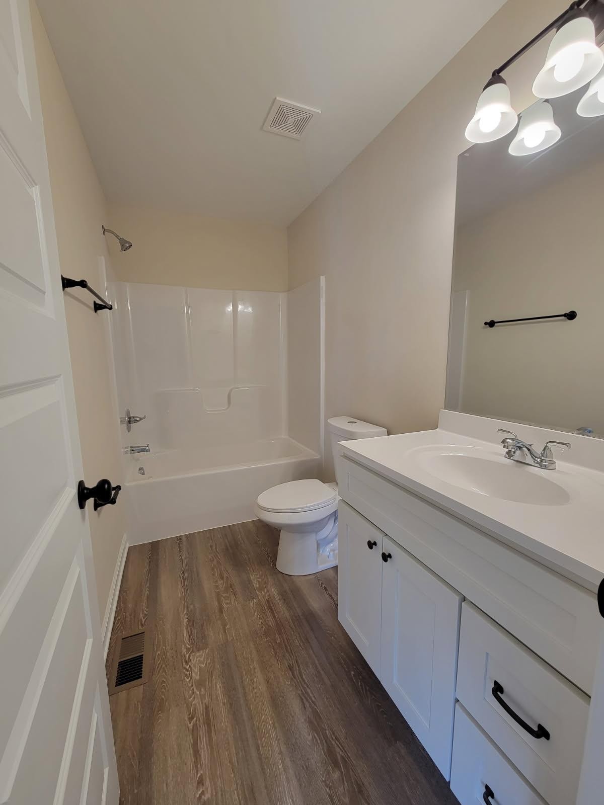 62 Modena Place Decherd, TN 37324 - Photo 17 of 31 a spacious bathroom with a sink a toilet a shower and a mirror