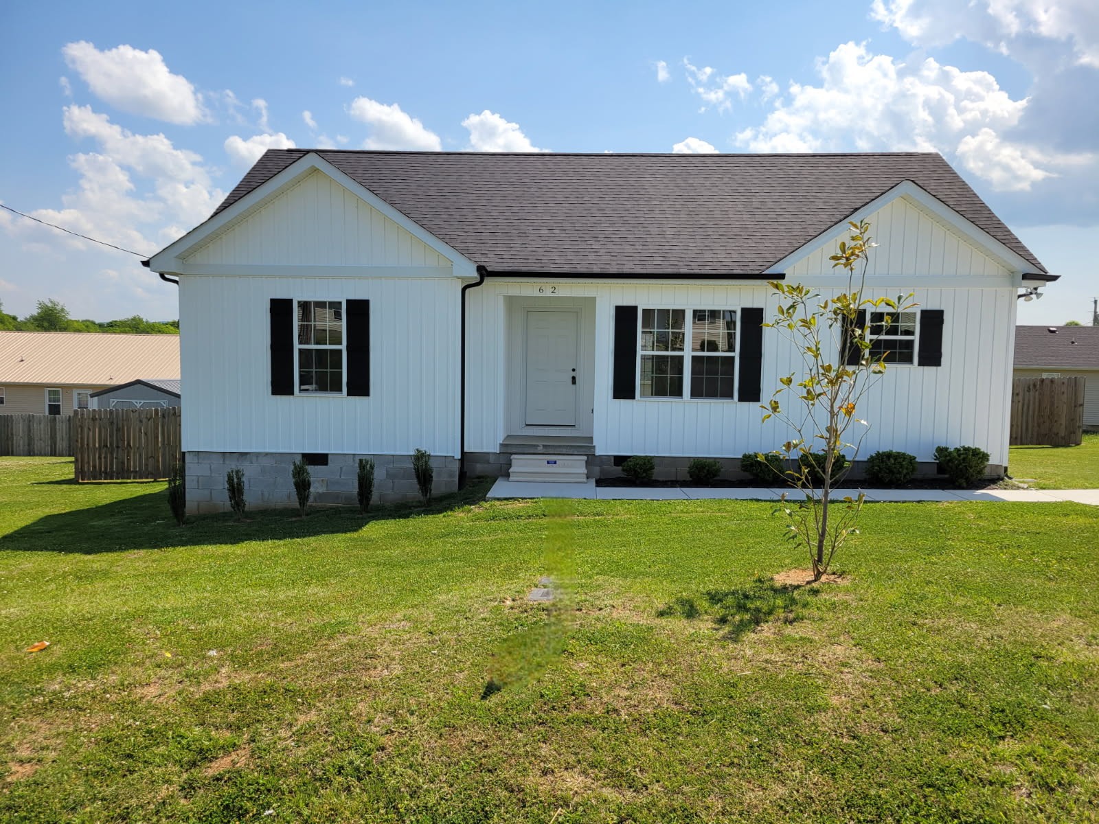 62 Modena Place Decherd, TN 37324 - Photo 2 of 31 a house that has a big yard in front of it