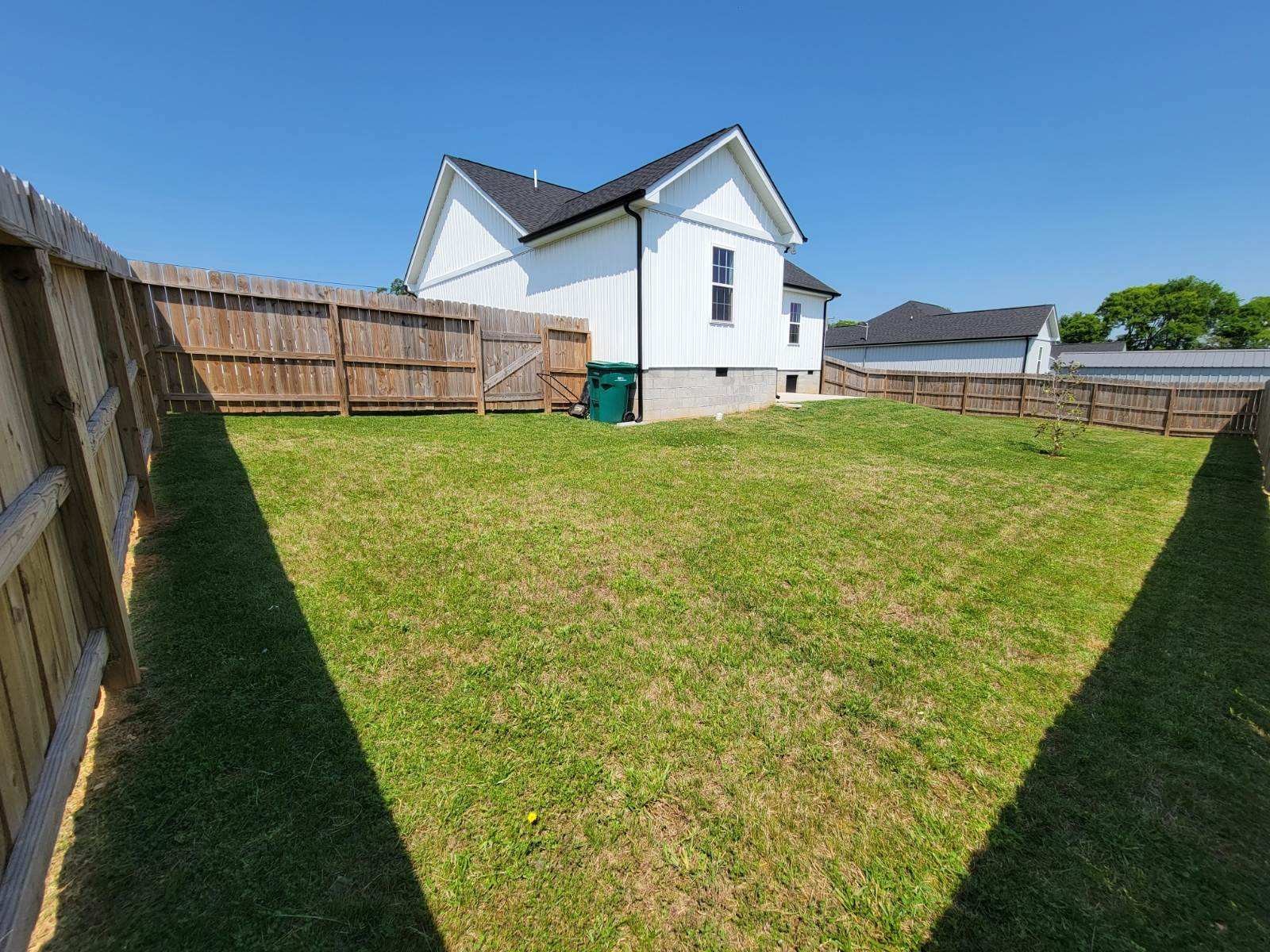 62 Modena Place Decherd, TN 37324 - Photo 30 of 31 a view of a house with a backyard