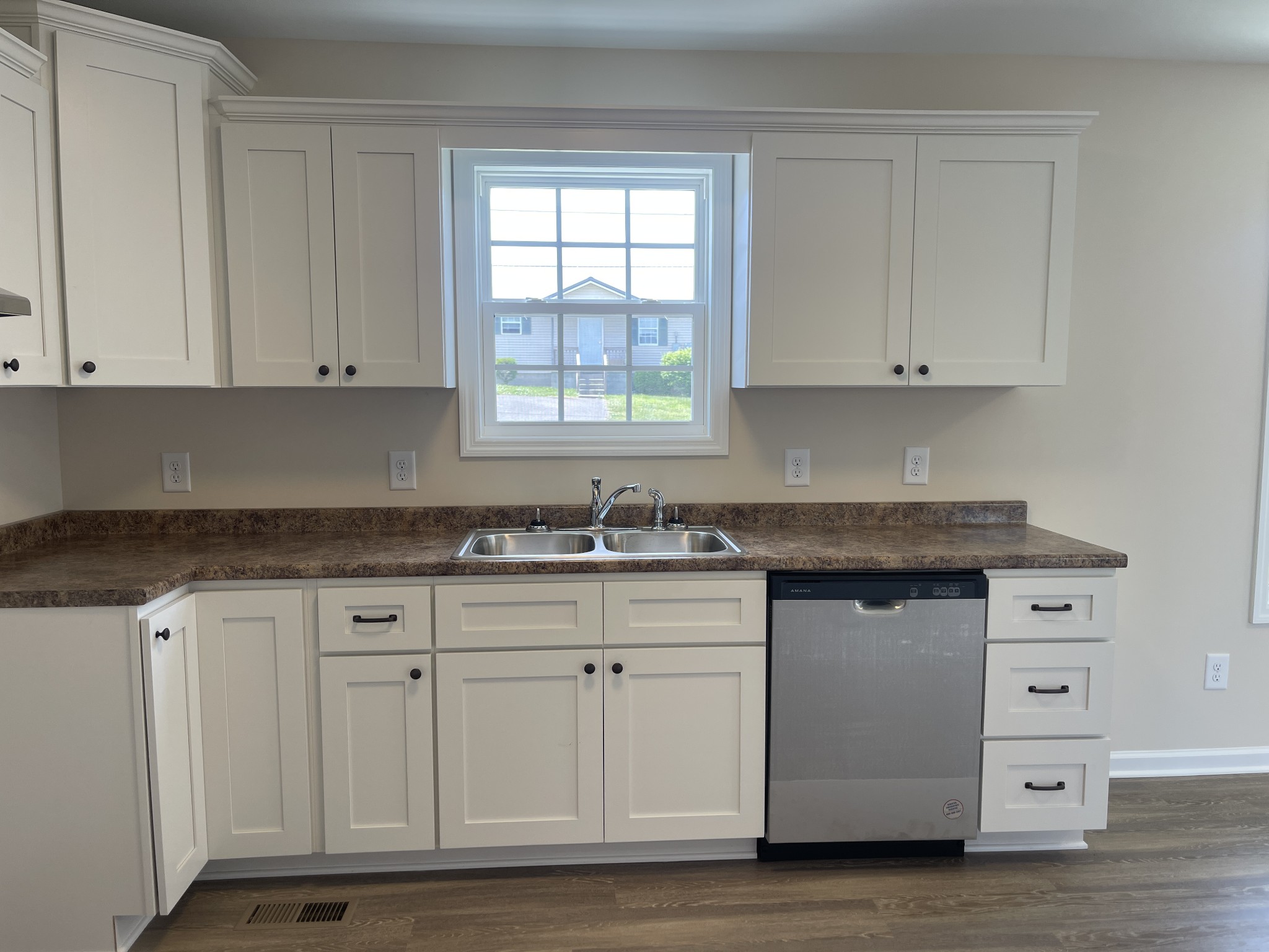 62 Modena Place Decherd, TN 37324 - Photo 5 of 31 a kitchen with granite countertop white cabinets and sink